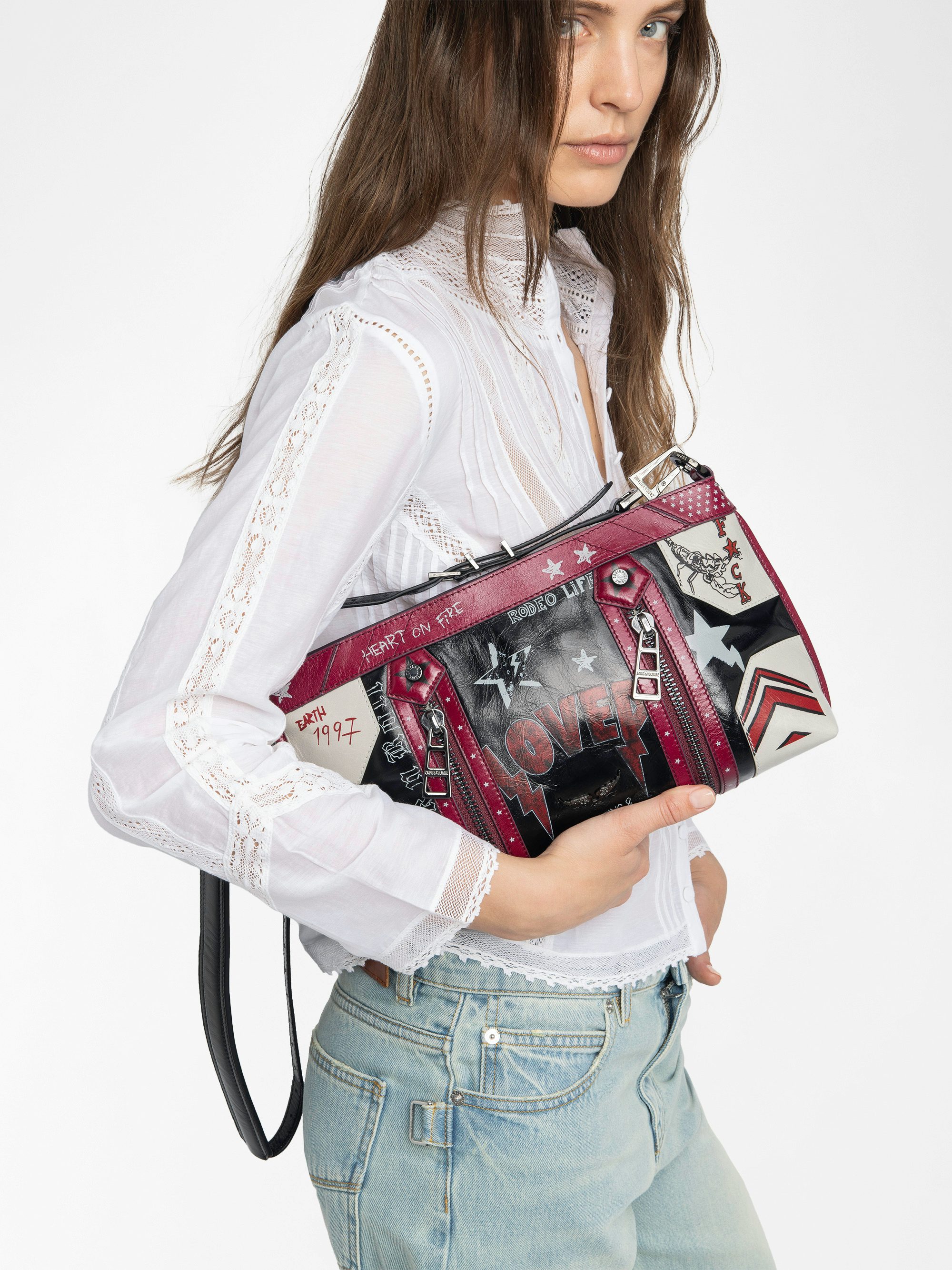 Sunny Moody Punk Bag - Vintage-inspired patent leather bag with adjustable shoulder strap and wing signature.